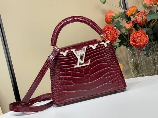 Exclusive photo of the original Capucines mini handbag M86153 48865 in burgundy