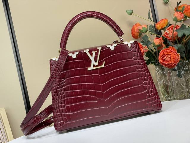 Exclusive photo of the original Capucines small handbag, M86154 48865, in burgun