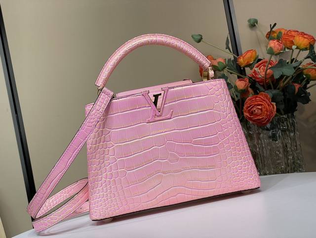 Exclusive photo of the original Capucines Bb handbag, M92173 48865, featuring a
