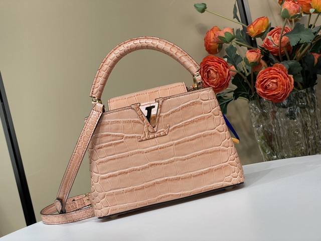 Exclusive photo of the original Capucines mini handbag M93429 48865 in orange cr