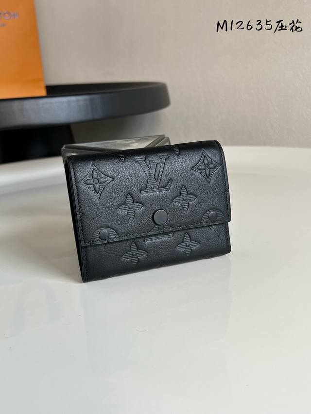 Factory Price: P Chip Edition M12635 Embossed Victor Wallet. This compact Victor