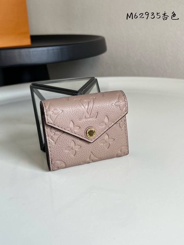 Factory Price: P M62935. This Zoe compact wallet is crafted from supple Monogram
