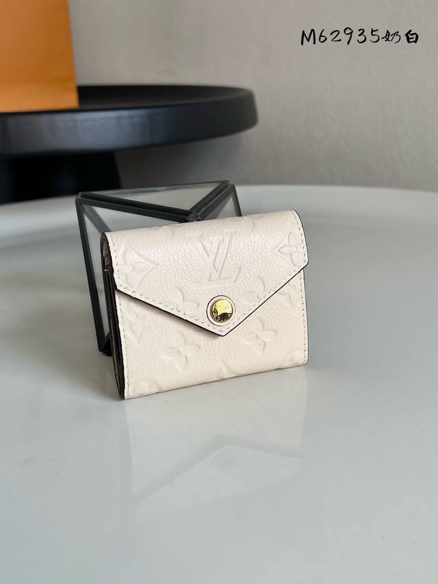 Factory Price: P M62935. This Zoe compact wallet is crafted from supple Monogram
