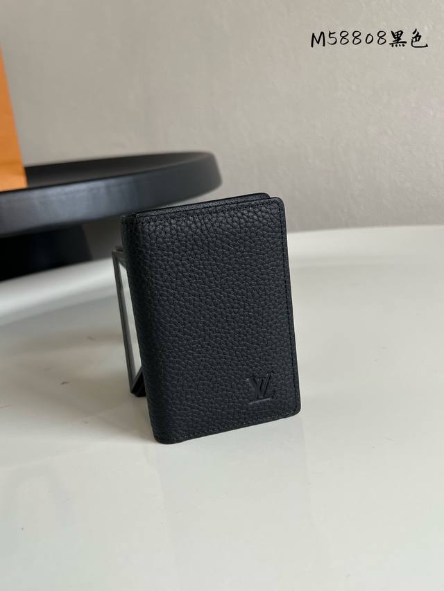 Factory Price: P M58808. This black pebbled card holder is crafted from ultra-so