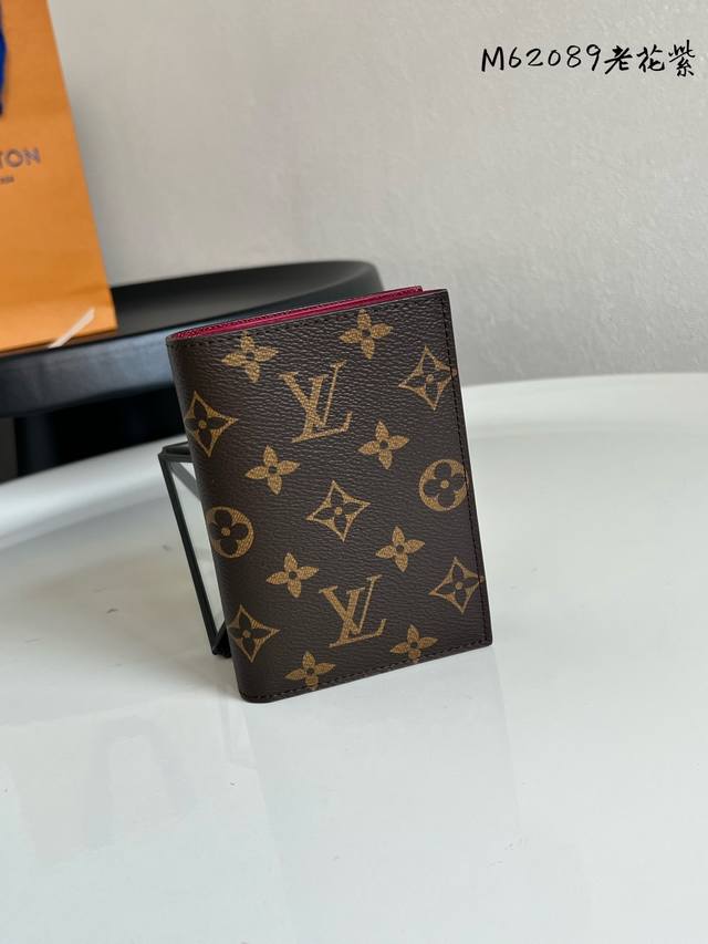 Factory Price: P M62089 This purple passport holder with monogram pattern is the