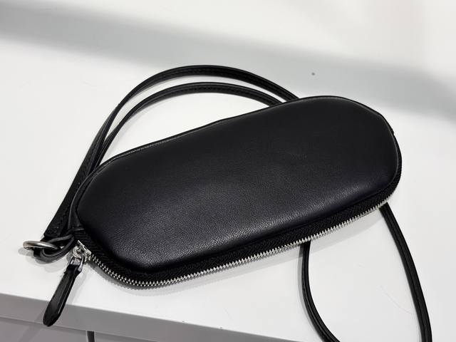 Tr The Row Sunglasses Case: A portable eyewear bag that combines elegance and pr