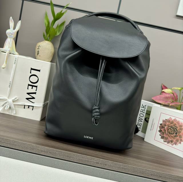 The new Lo*Ewe Flamenco backpack in shiny soft cowhide leather features a stream
