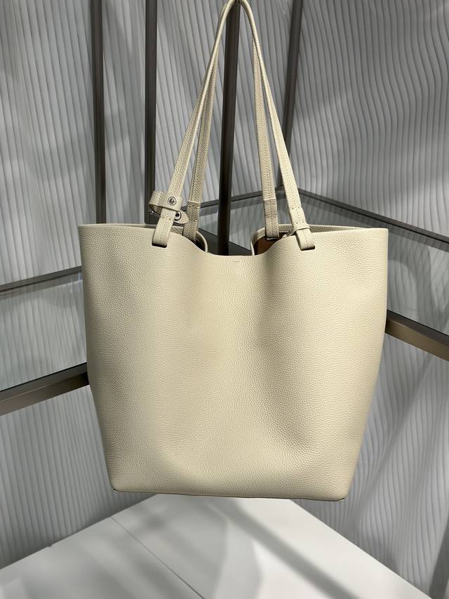 Tr The Row Park Tote. This upgraded leather tote bag features a unique casual an