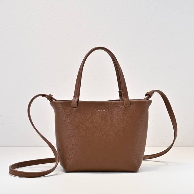 The Ro* Park Tote Mini Bag boasts a minimalist and refined design, creating a st