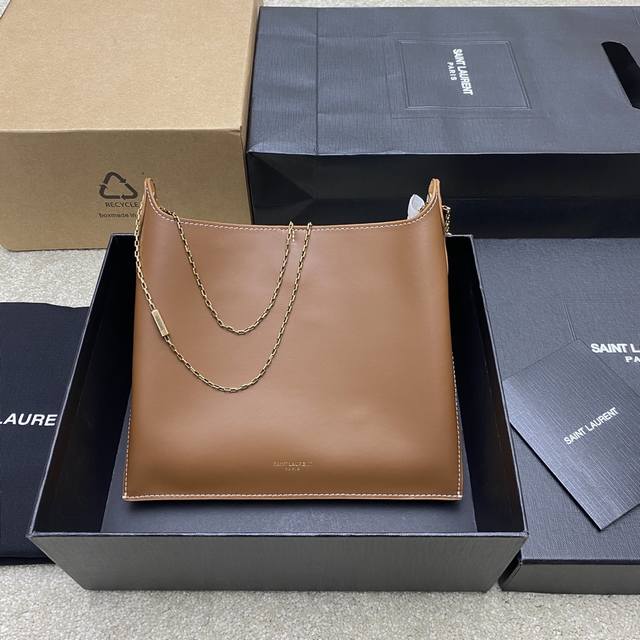 Brown and gold original leather, exclusive new arrival. The minimalist design of