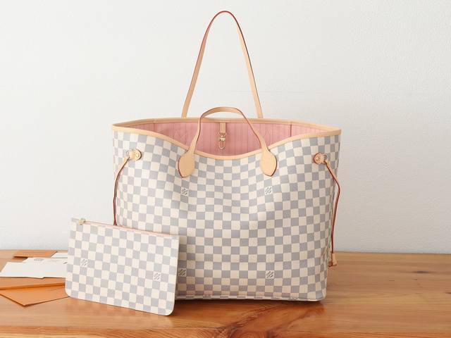 This premium, enhanced Neverfull large tote bag features Damier Azur canvas trim