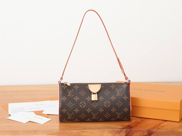 the premium, enhanced Pochette Tirette handbag, crafted in Monogram canvas with