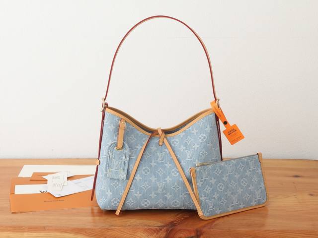 This premium, original, enhanced Carryall small bag, part of the Lv By The Pool