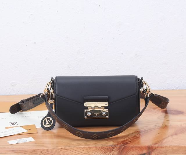 a top-quality original, all-steel and metal Swing bag, debuted at the Spring/Sum