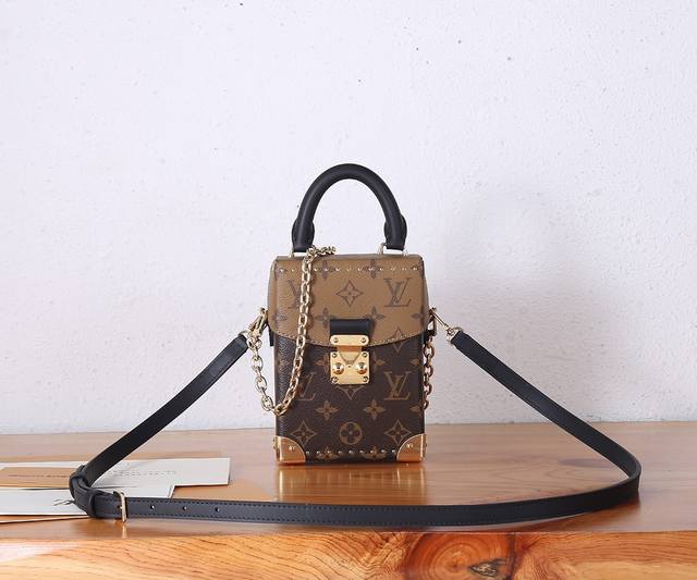 the premium, enhanced Camera Box bag, features a modern silhouette in Monogram a
