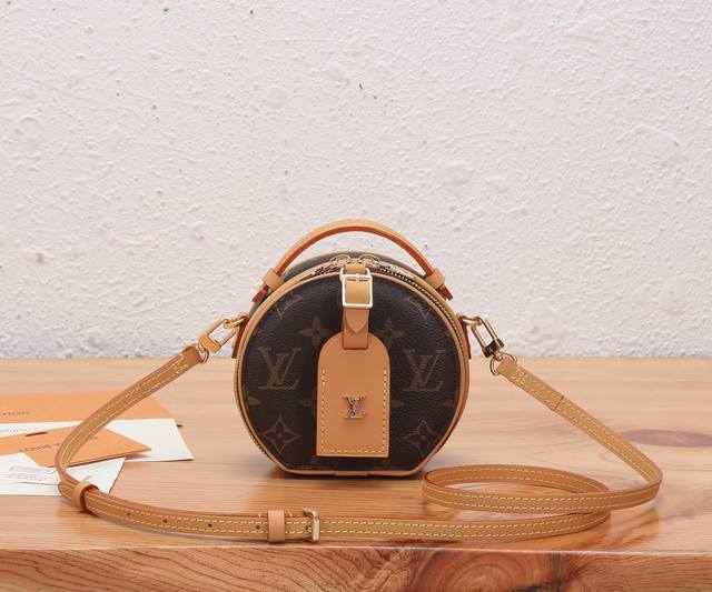 This premium, original, enhanced Bo?te Chapeau mini bag is crafted from Monogram