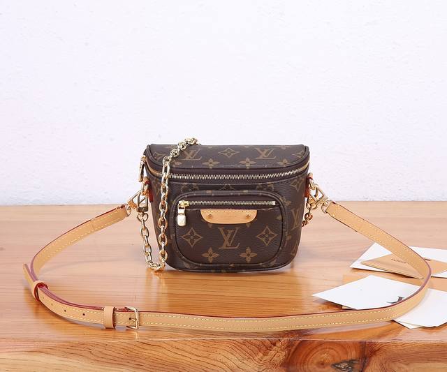 This premium, original, enhanced Mini Bumbag handbag is crafted from Monogram ca