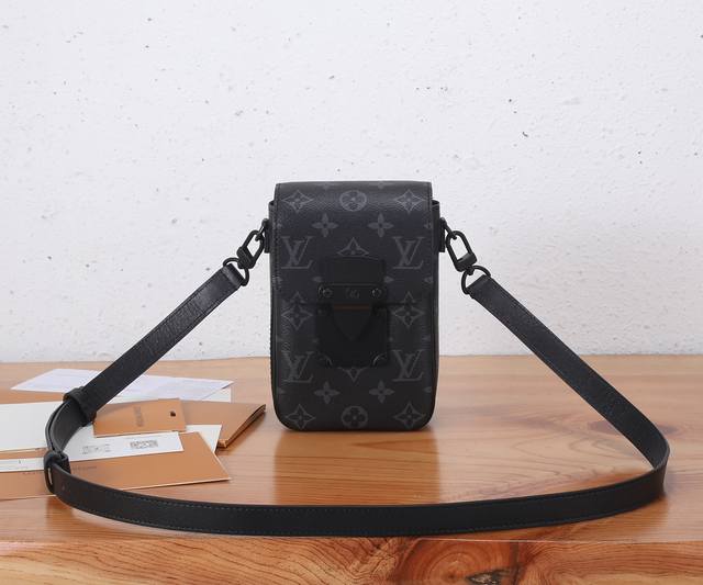 this premium, enhanced S-Lock Vertical mini bag is crafted from Monogram Eclipse
