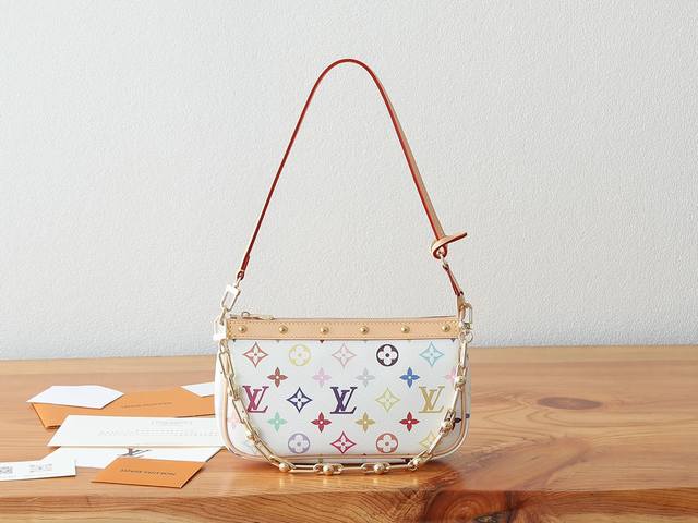 163C01 Dynamic Chip. This premium, enhanced Pochette Accessoires handbag is craf