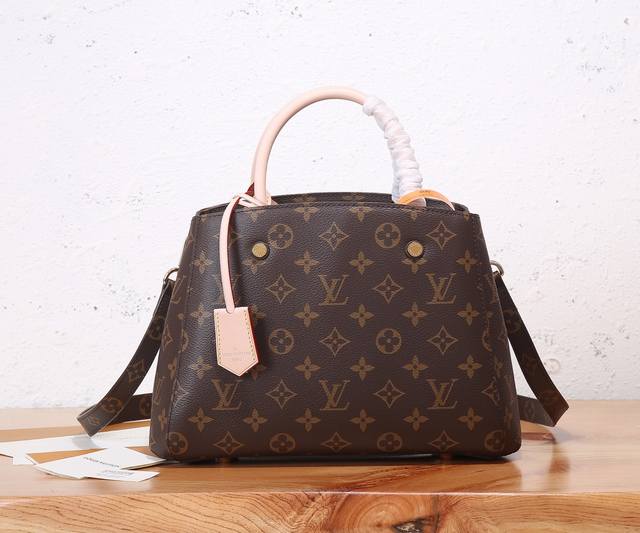 Premium Original, enhanced version of the Montaigne Bb handbag in iconic Monogra