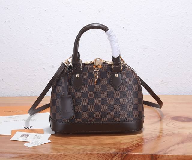 This authentic, enhanced version of the captivating Alma Bb bag, a classic Louis