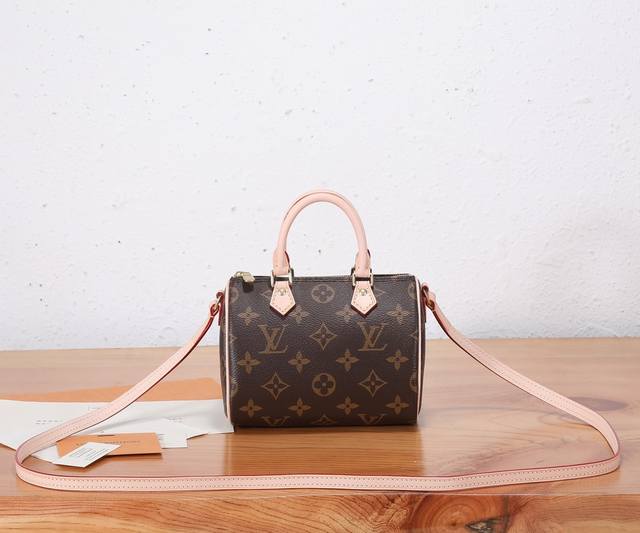 This Nano Speedy bag, crafted from premium, reinforced Monogram canvas, exudes f