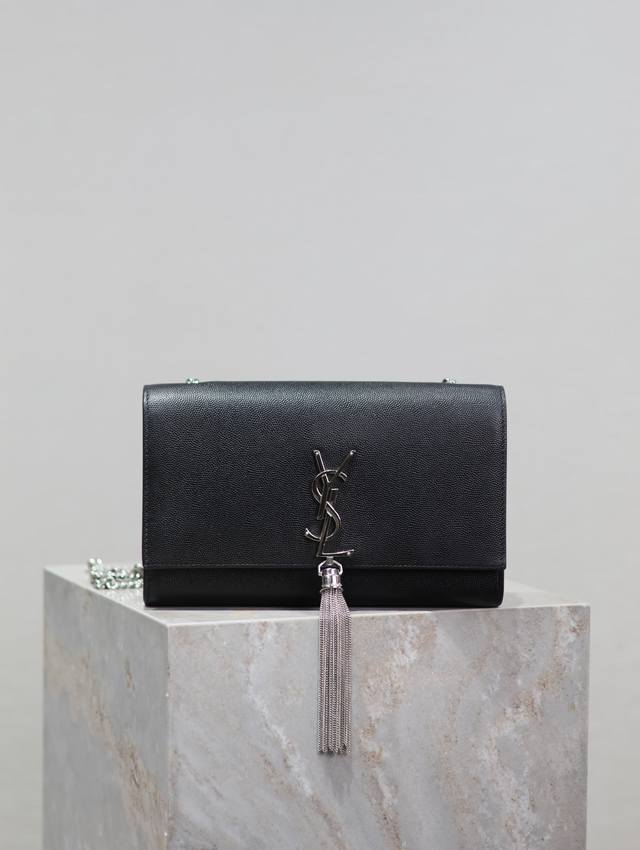 The timeless classic black silver buckle caviar Kate 24cm tassel bag is a timele