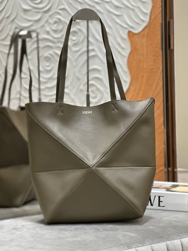 Original Lewe medium shiny cowhide Puzzle Fold mini in dark khaki green. Inspire