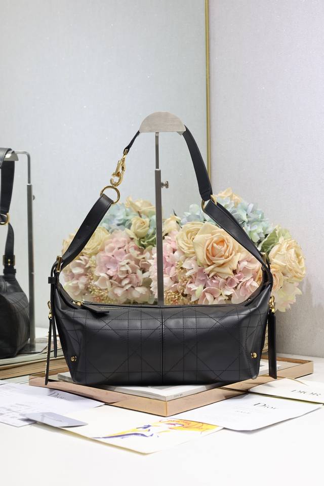 Authentic, high-edition small D-Journey handbag in black plain weave. This new a
