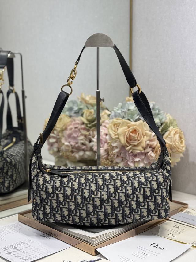 Authentic, high-version medium D-Journey handbag with monogram and leather. This