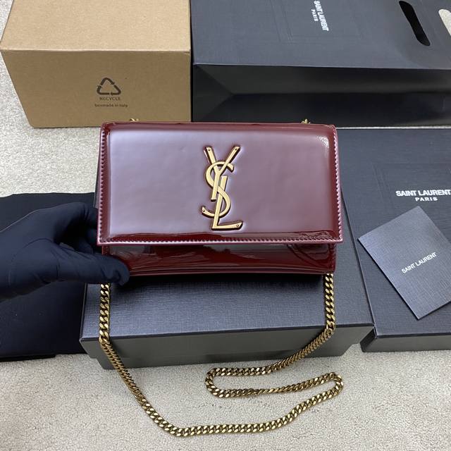 Original leather, burgundy patent leather, antique gold YSL Kate. This glossy pa
