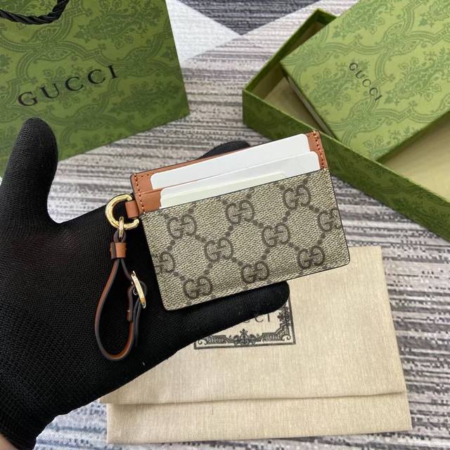 Premium Gg Emblem Collection Charm Bag with Card Holder. The Gg Emblem collectio