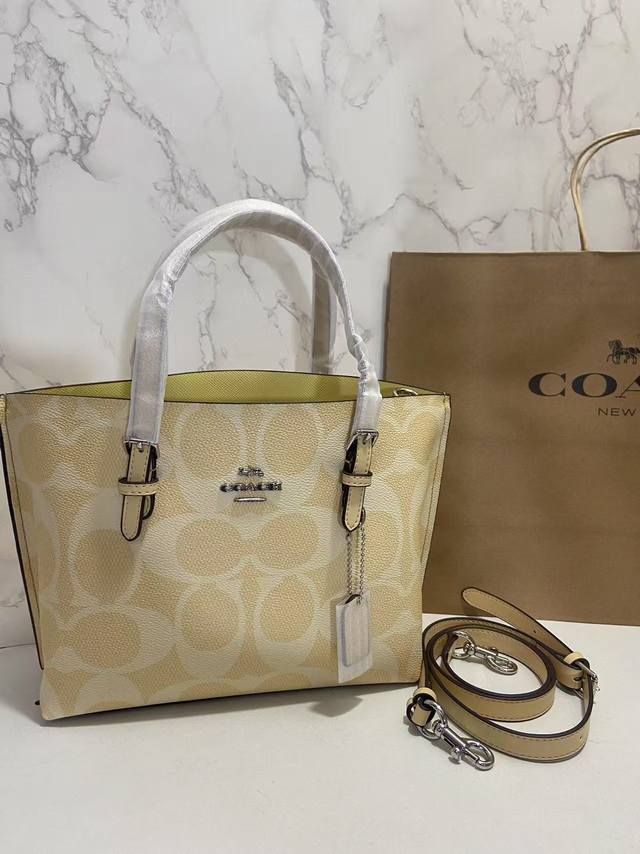 Coa*H April new arrival: Mollie 25 Cal50 in goose yellow, a classic bag with a s