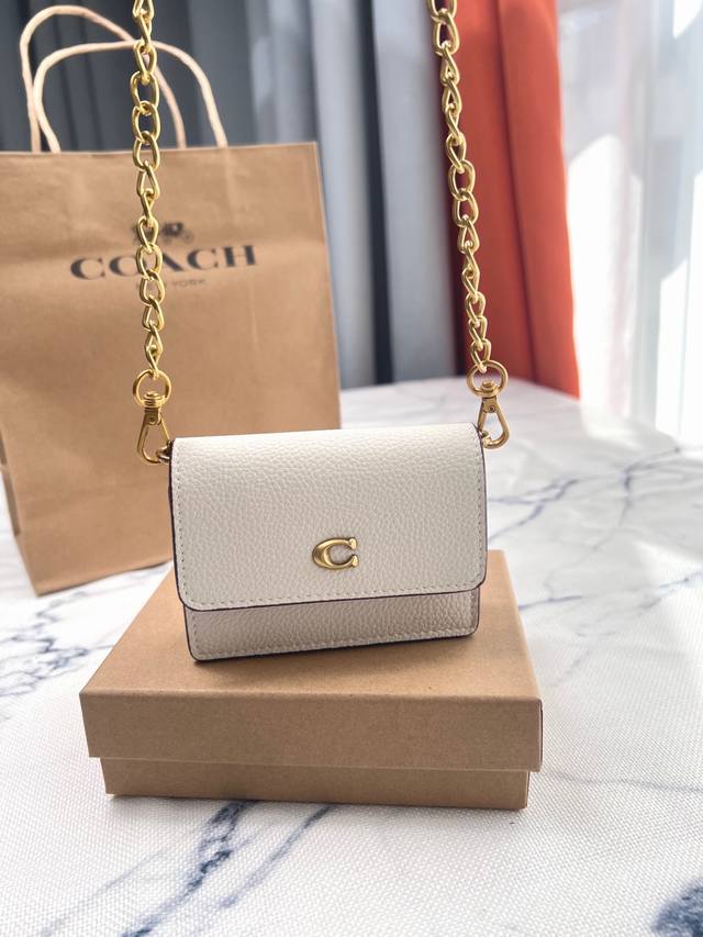 Coach's stylish classic mini chain small square bag in white with lychee pattern