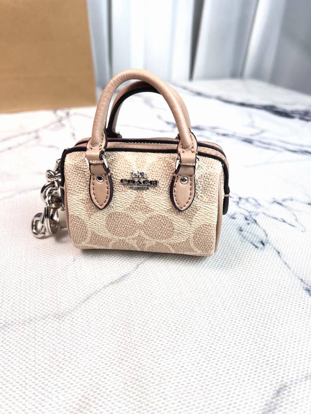 C's Cu279Mini mini version of the new Boston pillow bag for women can be carried