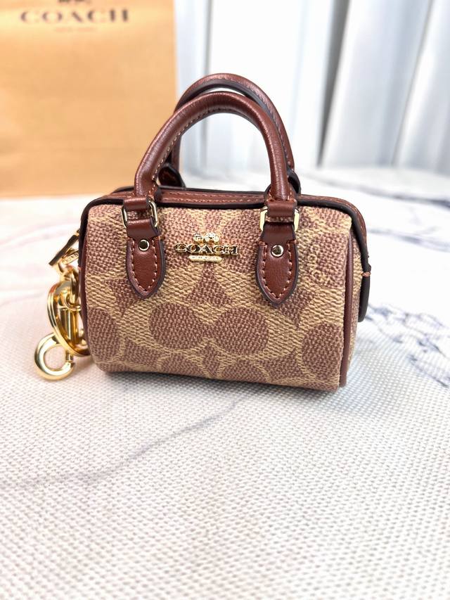 C's Cx068Mini mini version of the new Boston pillow bag for women, with a hand-h