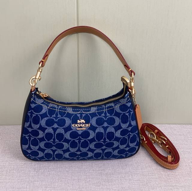 Coach's new Caf82 Teri denim underarm bag, new arrival for January 2025. Very ni