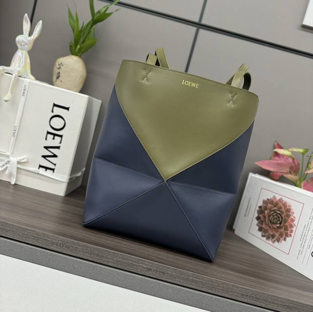 Lw's new small colorblock shiny cowhide Puzzle Fold Tote takes the iconic geomet