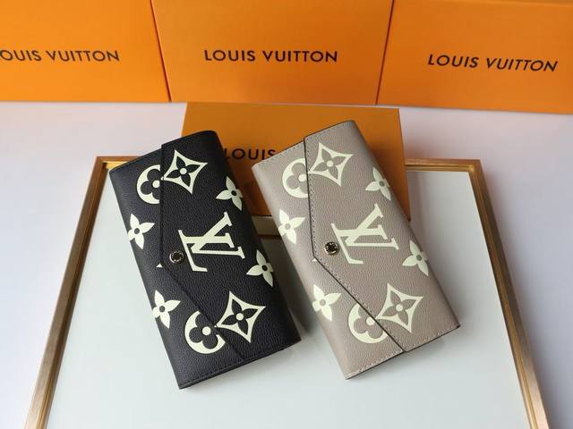 Color Black and Gray Size 19.5X10.5 The wallet is made of two-tone Monogram Empr