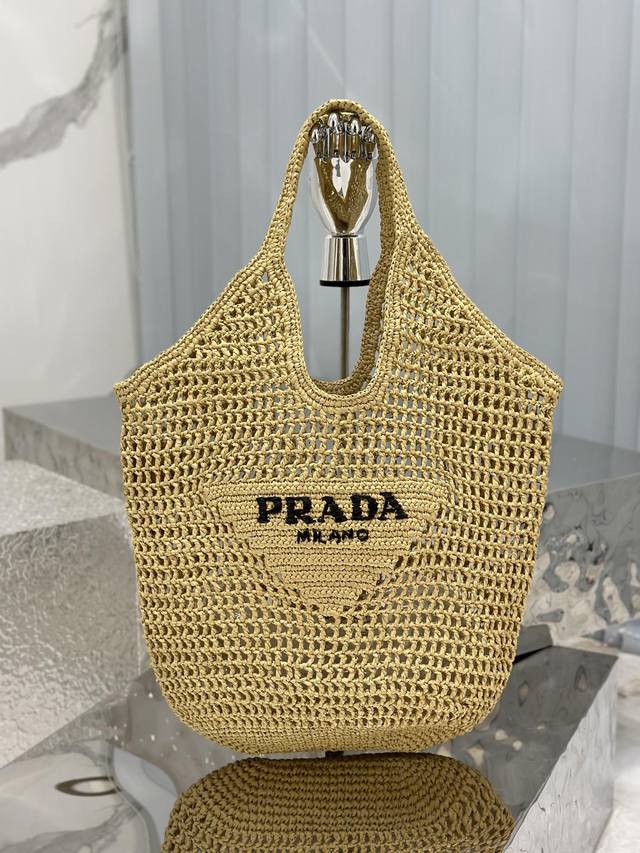 Raffia Woven Tote Bag. This tote is crafted from raffia fiber in a soft, deconst