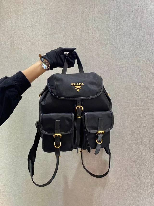 New Backpack 1Bz677A This nylon backpack features exquisite Saffiano leather tri