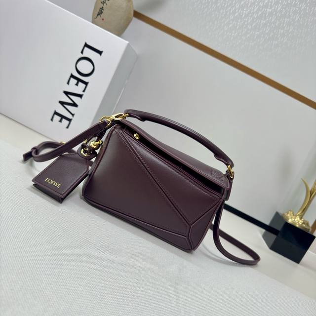Low The new miniature nappa leather Featherlight Puzzle handbag features a recta