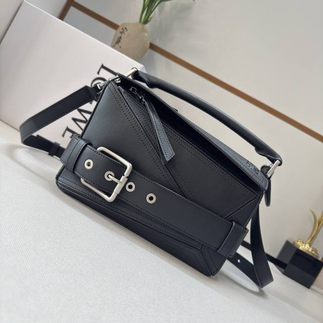 Luo Jia's new small shiny cowhide Puzzle Biker bag. Its rectangular shape is def