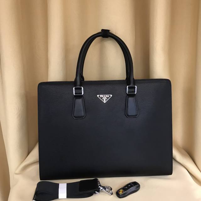 Prada is shipping! This briefcase features genuine YKK hardware