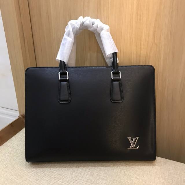 shipped Lv. Authentic YKK hardware on this briefcase. You'll understand how good