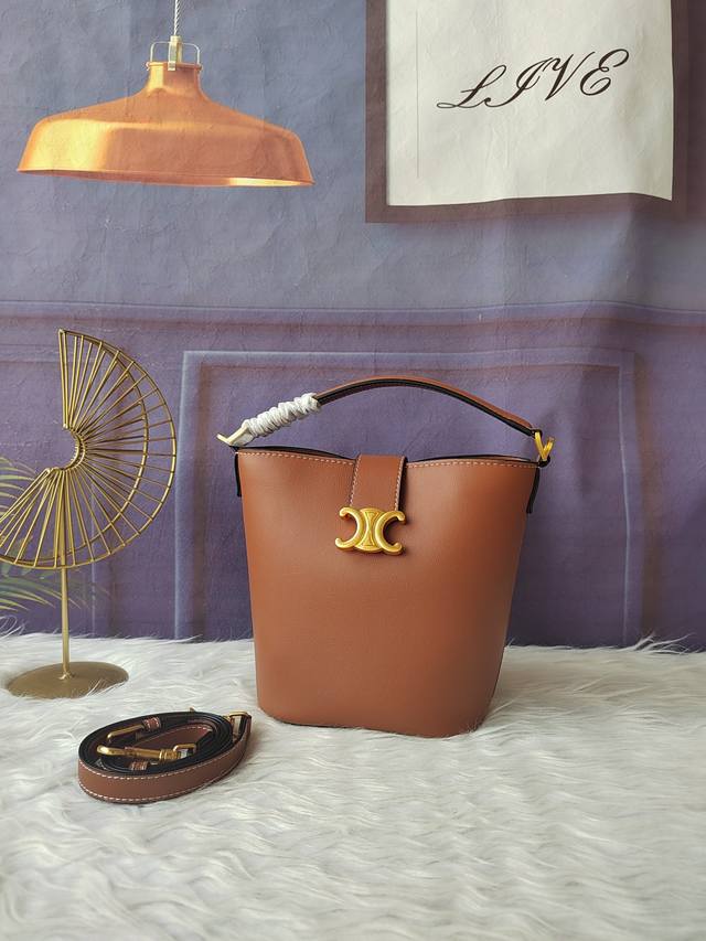 Style 119173 Brown small bucket bag, gold finish handle, shoulder and crossbody,