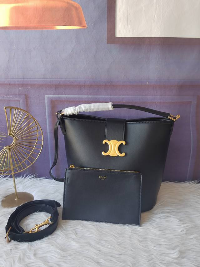 Style 116613 Black bucket bag with gold finish, hand-held, shoulder and crossbod