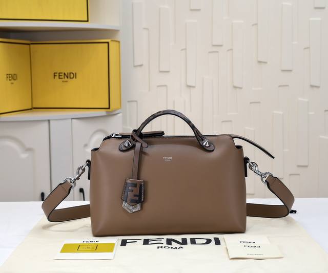 embossed double handles and charm, with a double pocket inside that is divided i