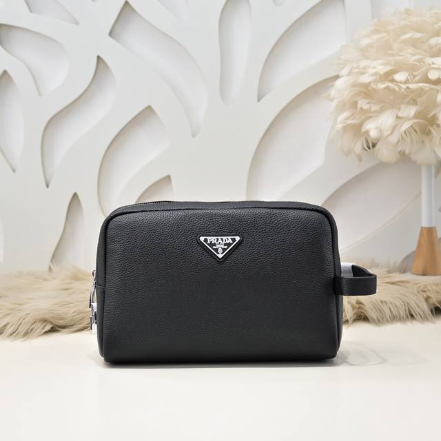 Prada - Prada's latest men's clutch is made of imported calfskin leather with a