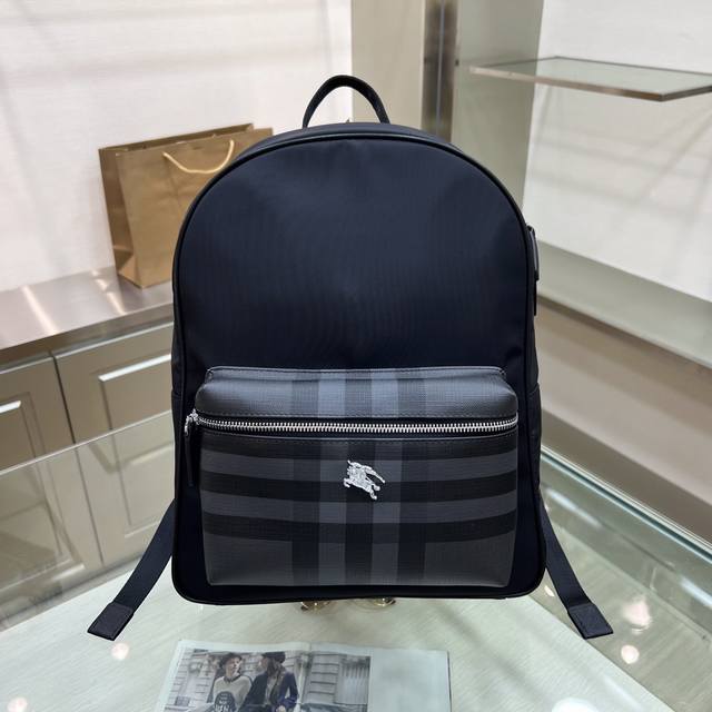 Burberry Burberry men's backpack is made of London check leather and waterproof